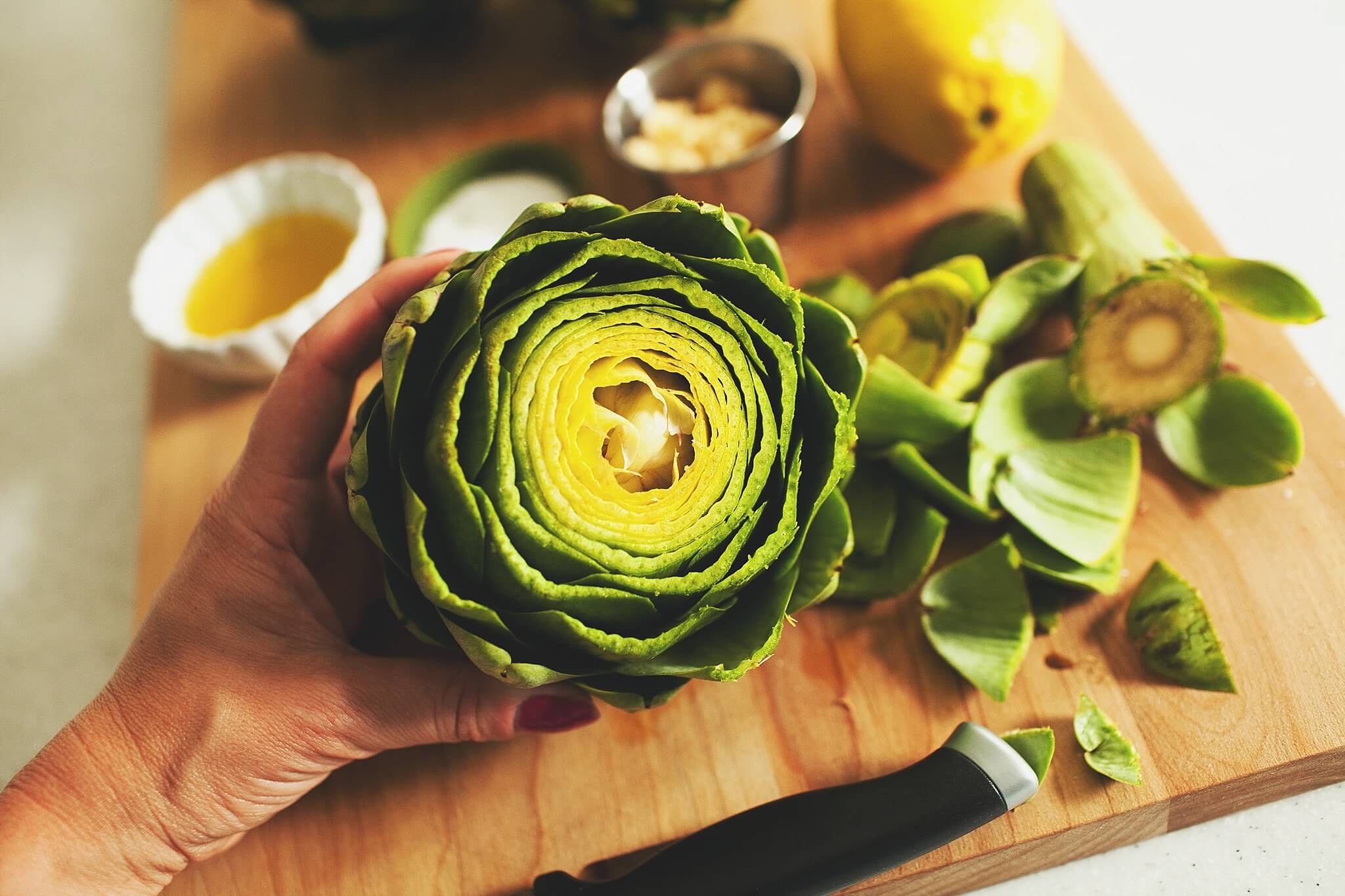 How to Cook Crockpot Artichokes - Step 3: trim the top 