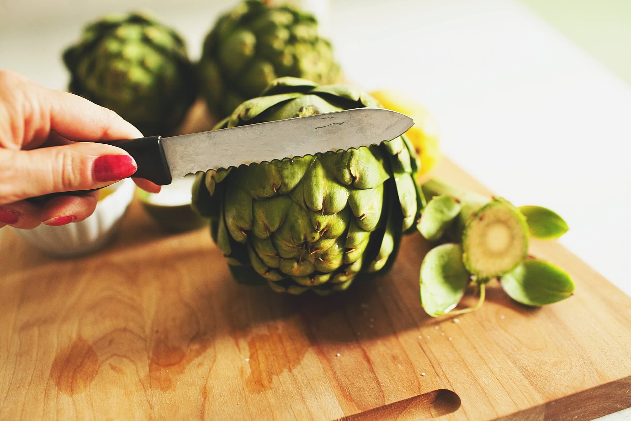 How to Cook Crockpot Artichokes - Step 3: trim the top 