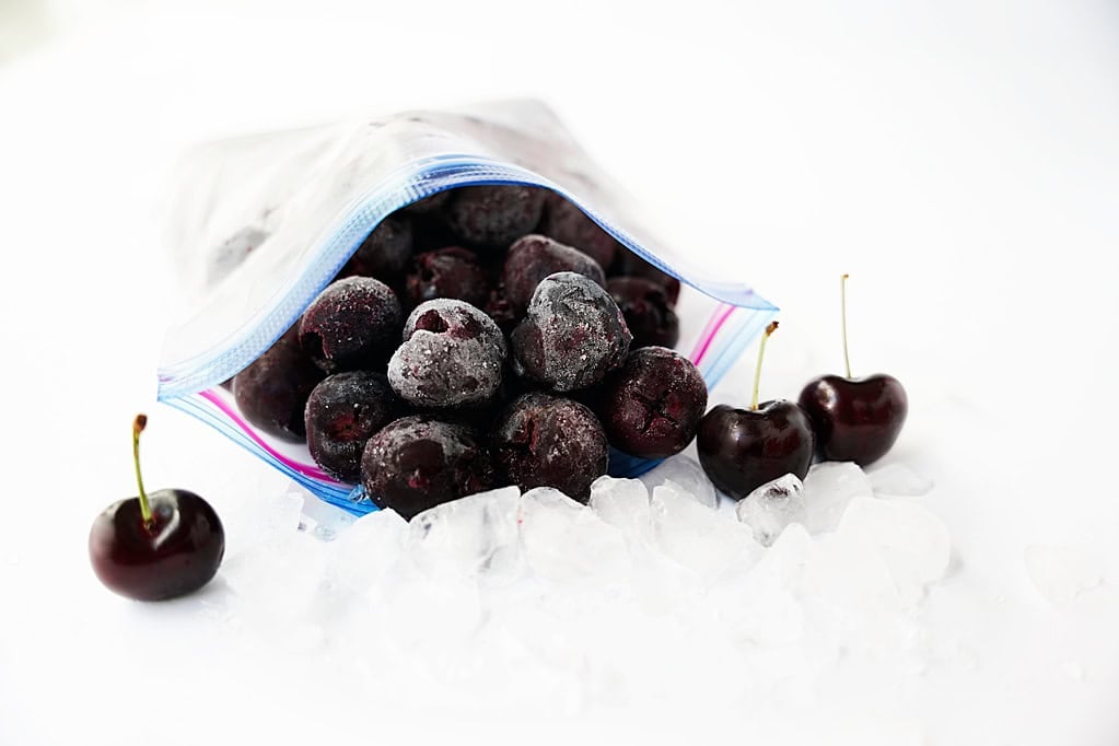 frlozen cherries in bag with ice