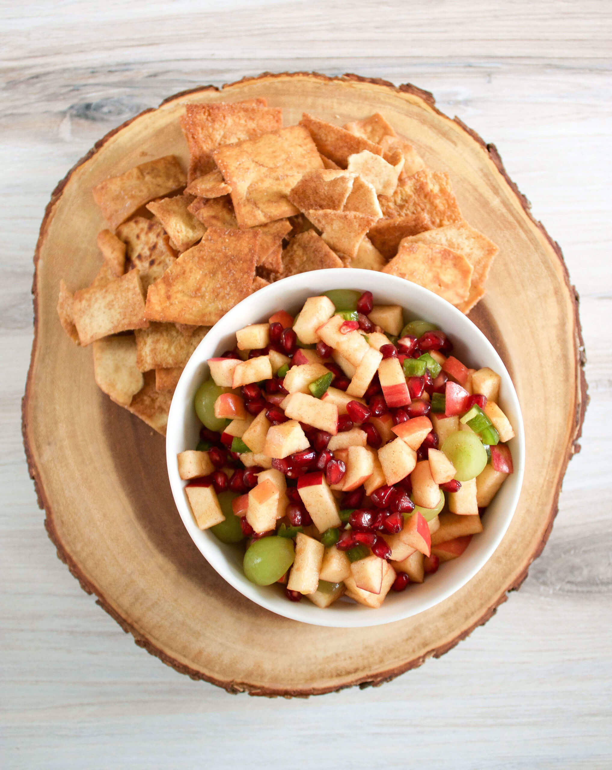 bowl of apple salsa with side of pita chips