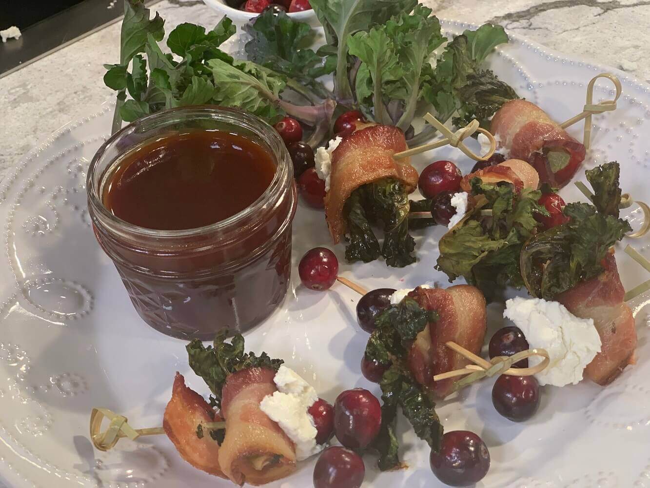 Bacon-Wrapped Kale Sprouts with Goat Cheese and Cranberries