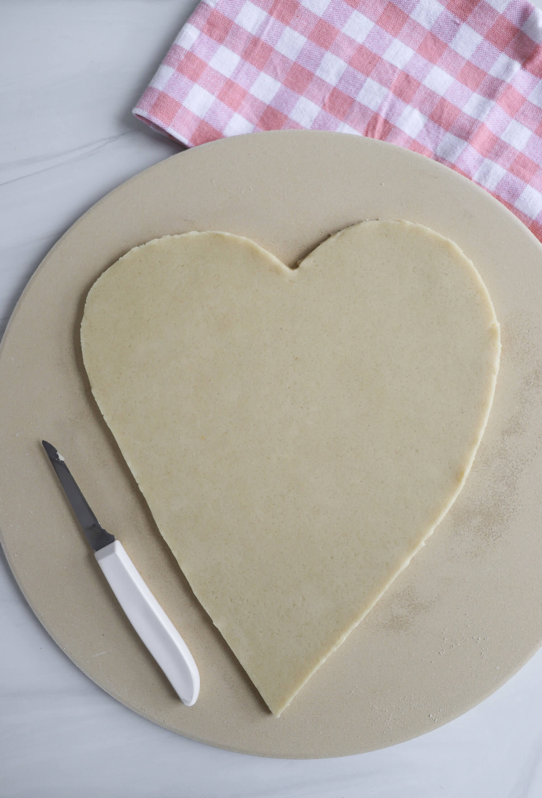 Making a heart-shaped pizza 