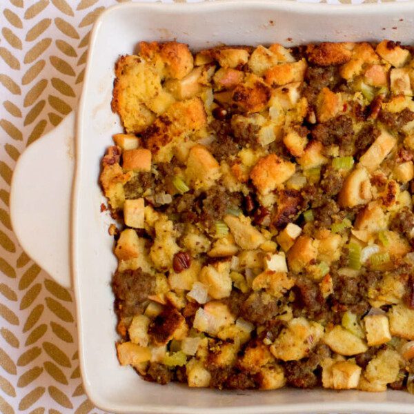 Flat lay photo of a baking dish with Cornbread Sausage Stuffing with apples
