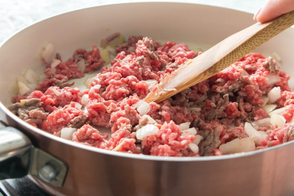 meat sauce starting to cook in a pot