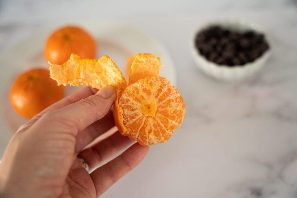 Peeling a mandarin orange