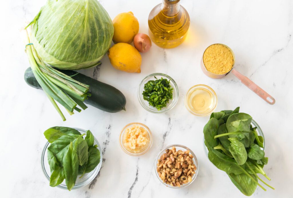 Ingredients to make the Green Goddess Salad: Cabbage, lettuce, lemons, cucumbers, garlic, olive oil, shallot