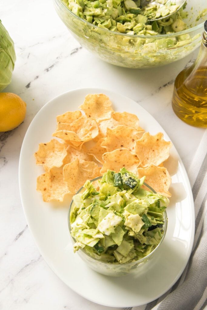 Green Goddess Salad on a plate with tortilla chips