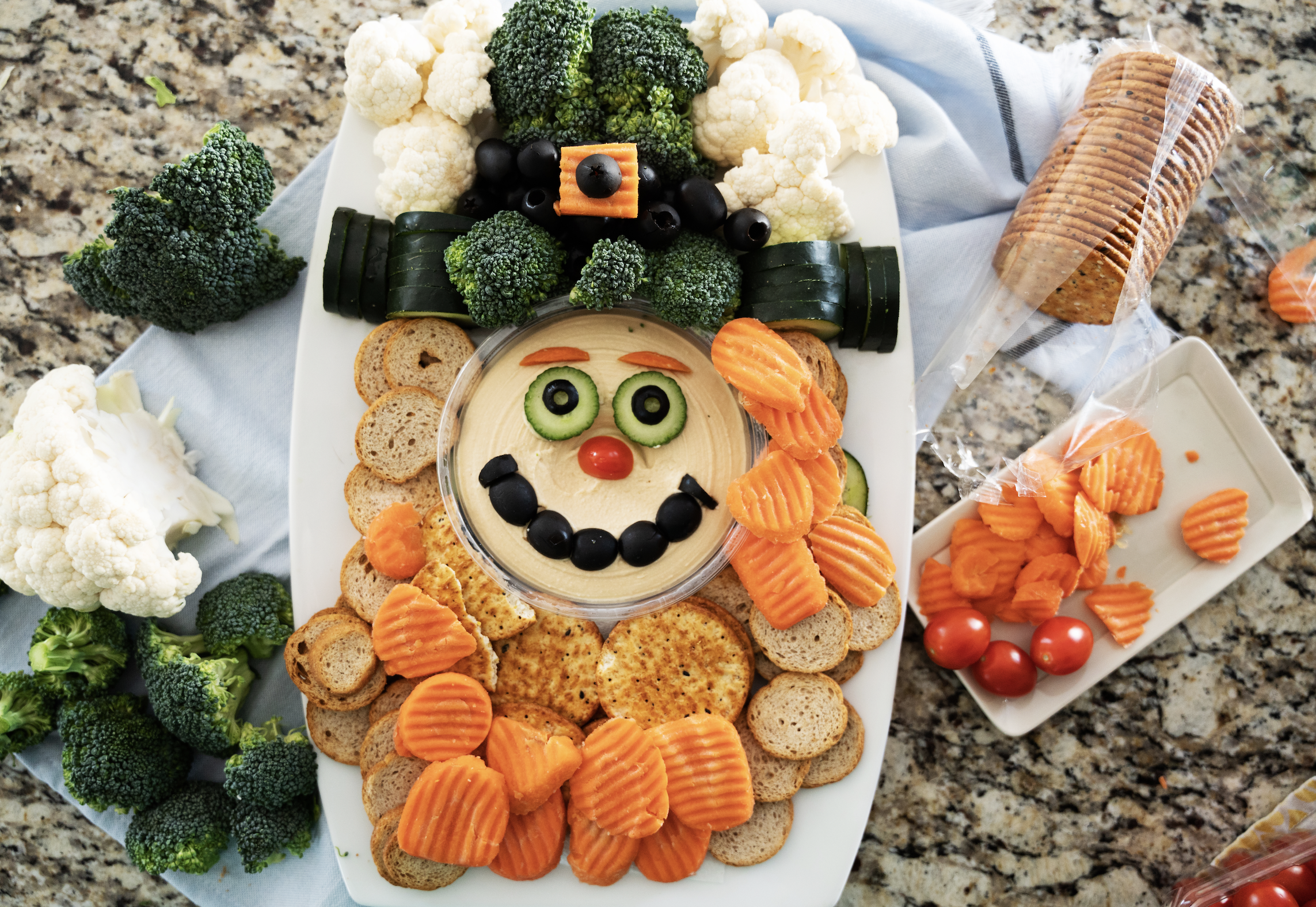 Leprechaun build out: adding the carrot coins and crackers for the beard.