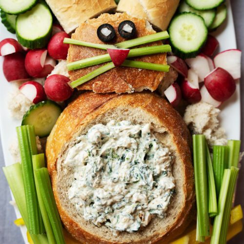 spinach artichoke bread bowl bunny inspired on serving platter with vegetables