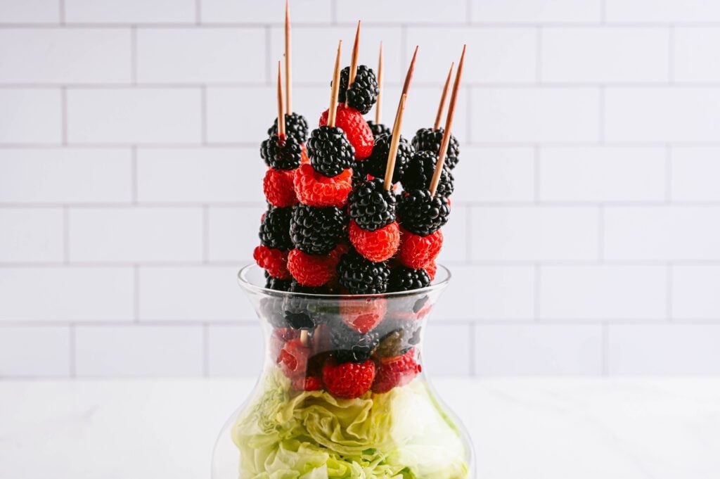 berries on skewers and in a vase