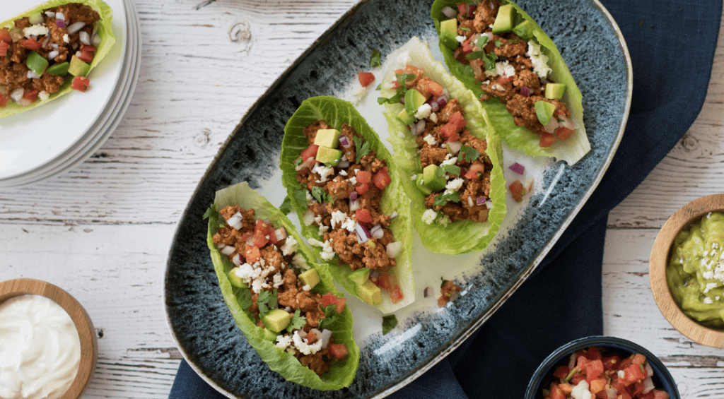 Plate of lettuce wraps with taco fillings