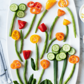 Flowers made out of vegetables on white plate