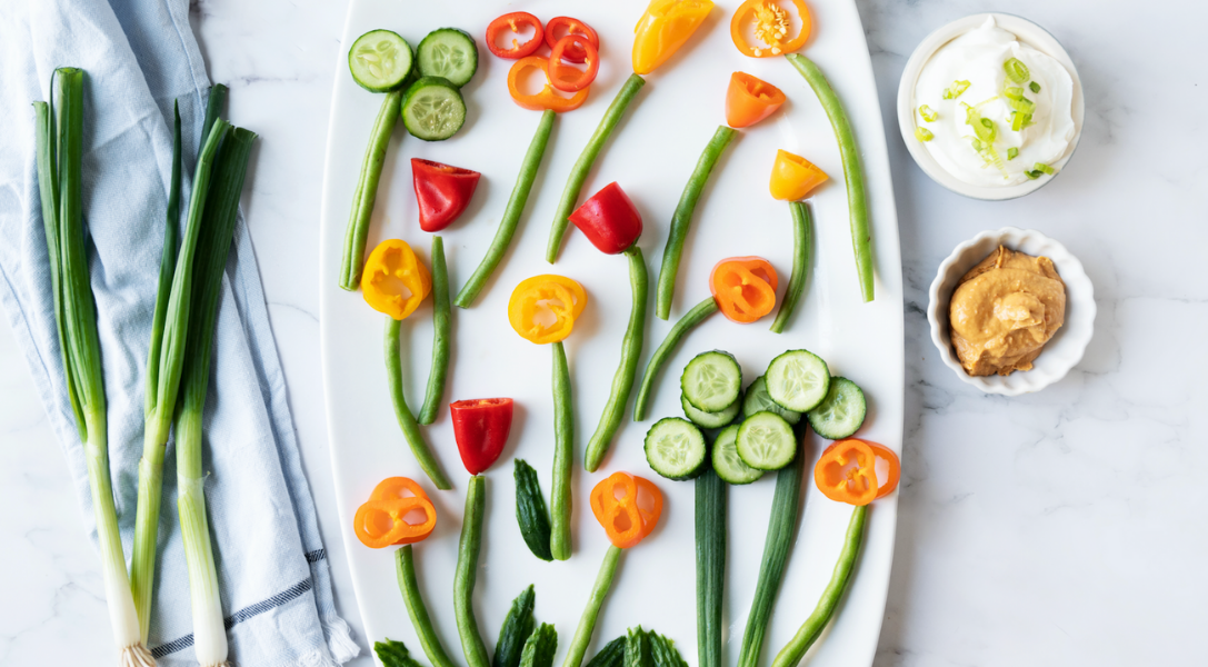 Flowers made out of vegetables on white plate