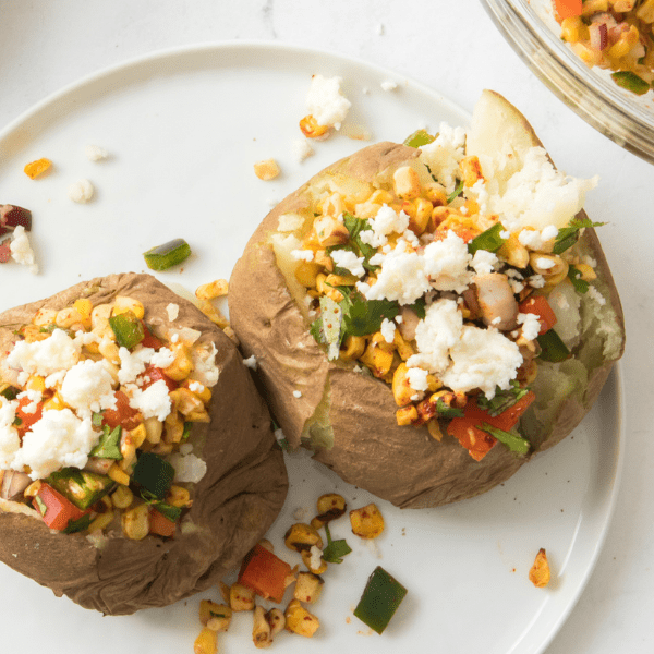 Two Baked Potatoes filled with Mexican Street Corn