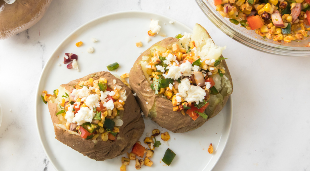 Two Baked Potatoes filled with Mexican Street Corn