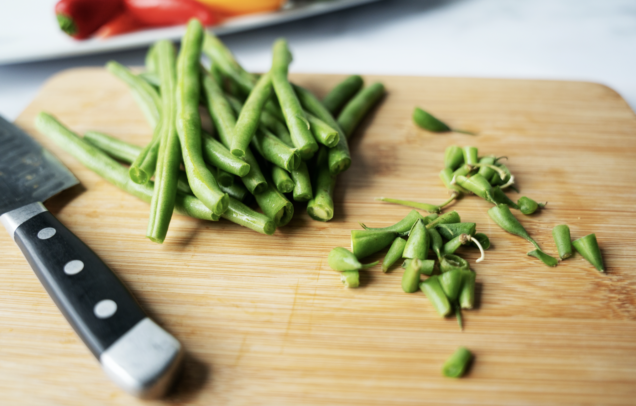Green beans on board with ends cut off