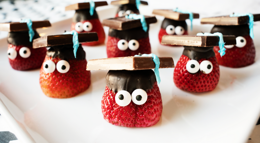 Plate of Strawberries in chocolate graduation caps