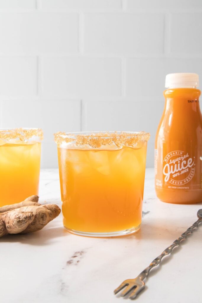 Two glasses of Mandarin cocktail + Mandarin Squeezed Juice