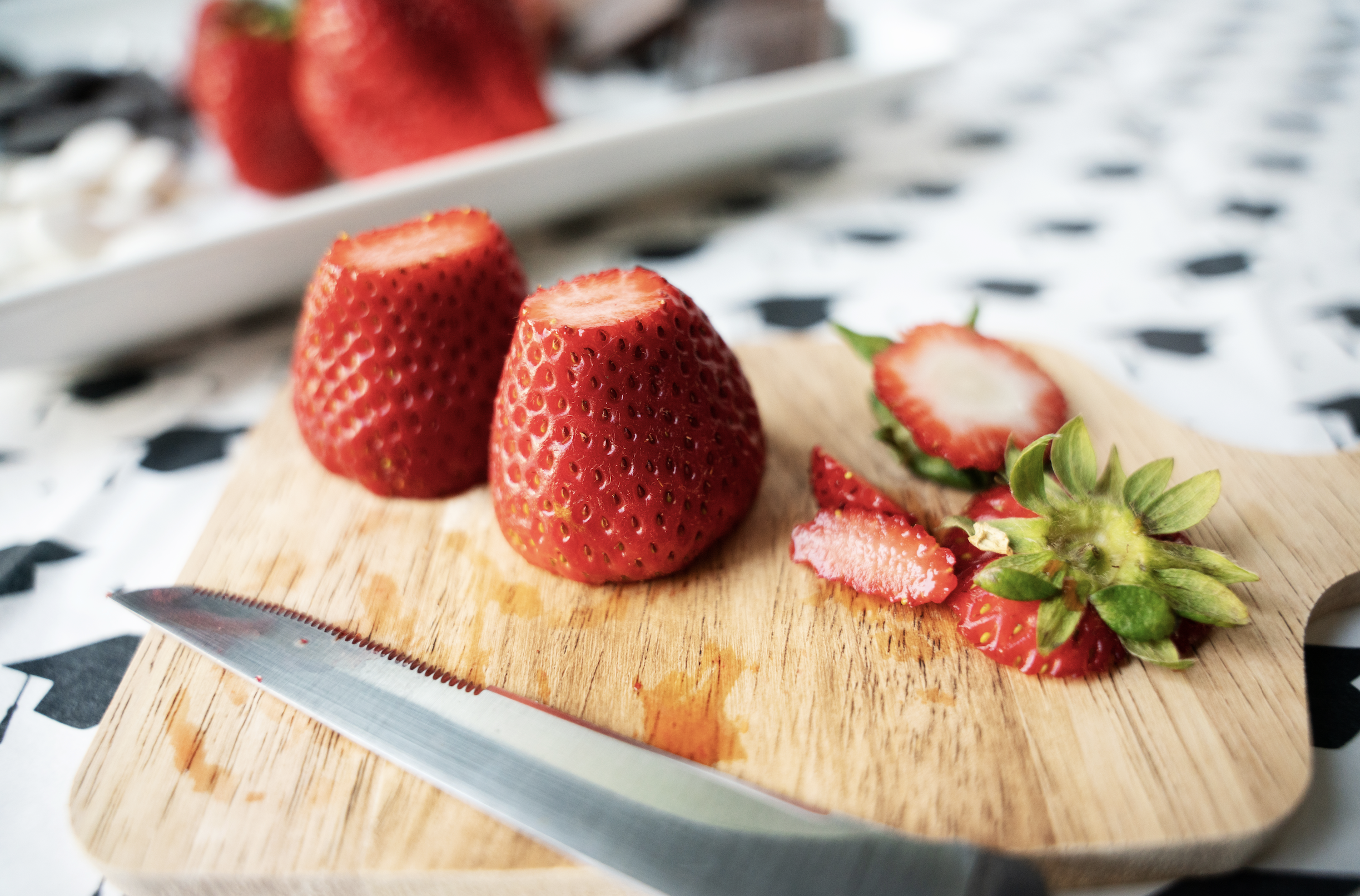 Graduation Dessert: Tops cut off the strawberries