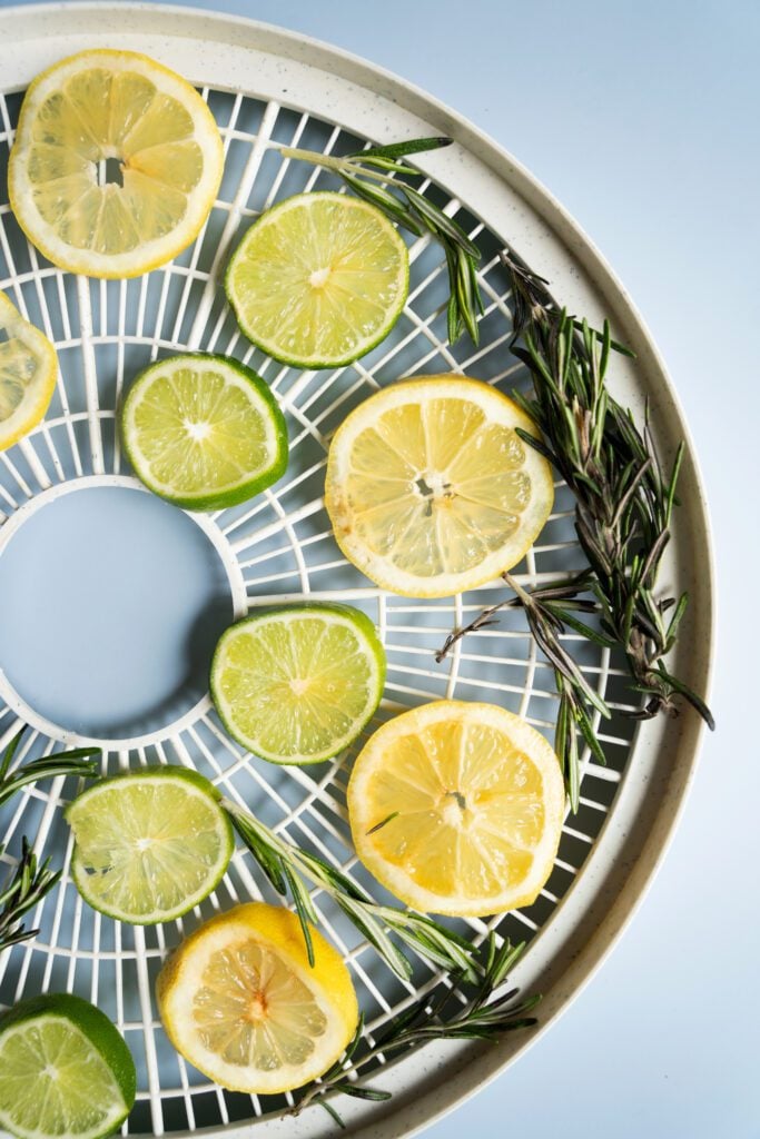 lemon, limes and rosemary in a dehydrator