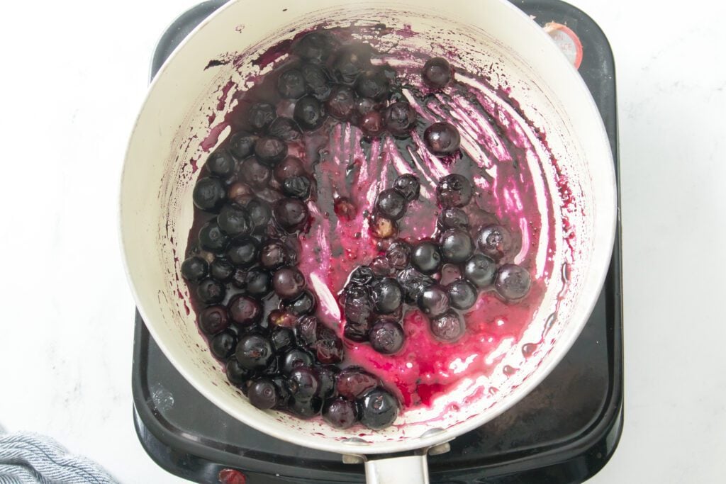Naturipe blueberries and water cooking in saucepan