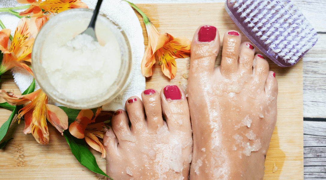 overhead view of foot scrub on feet