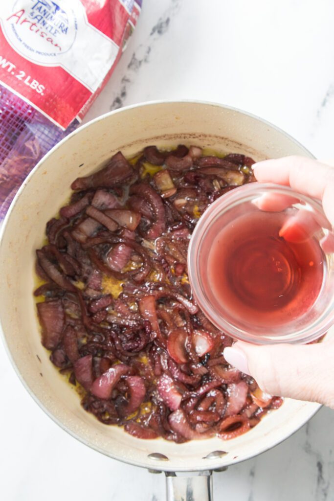 add red wine vinegar into saucepan