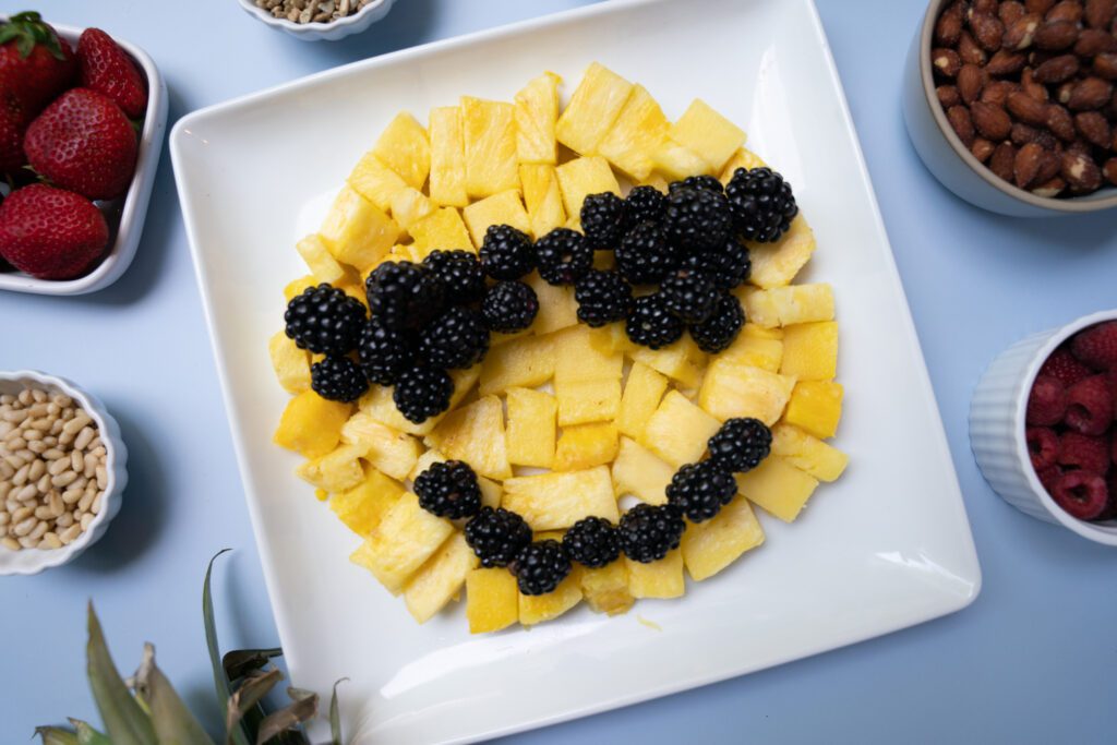 cool emoji made with blackberries and pineapple