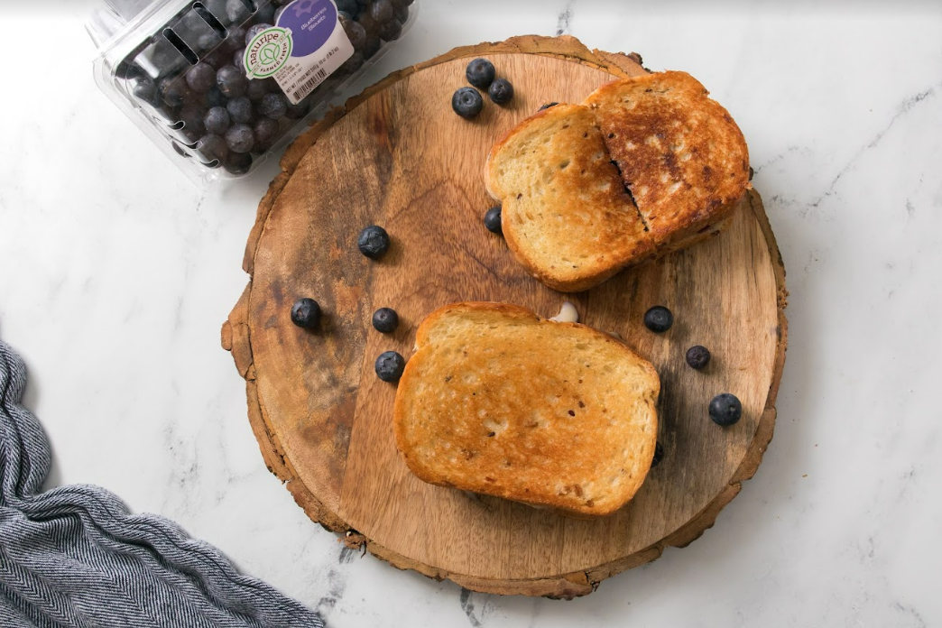 Blueberry Brie Grilled Cheese on wood board