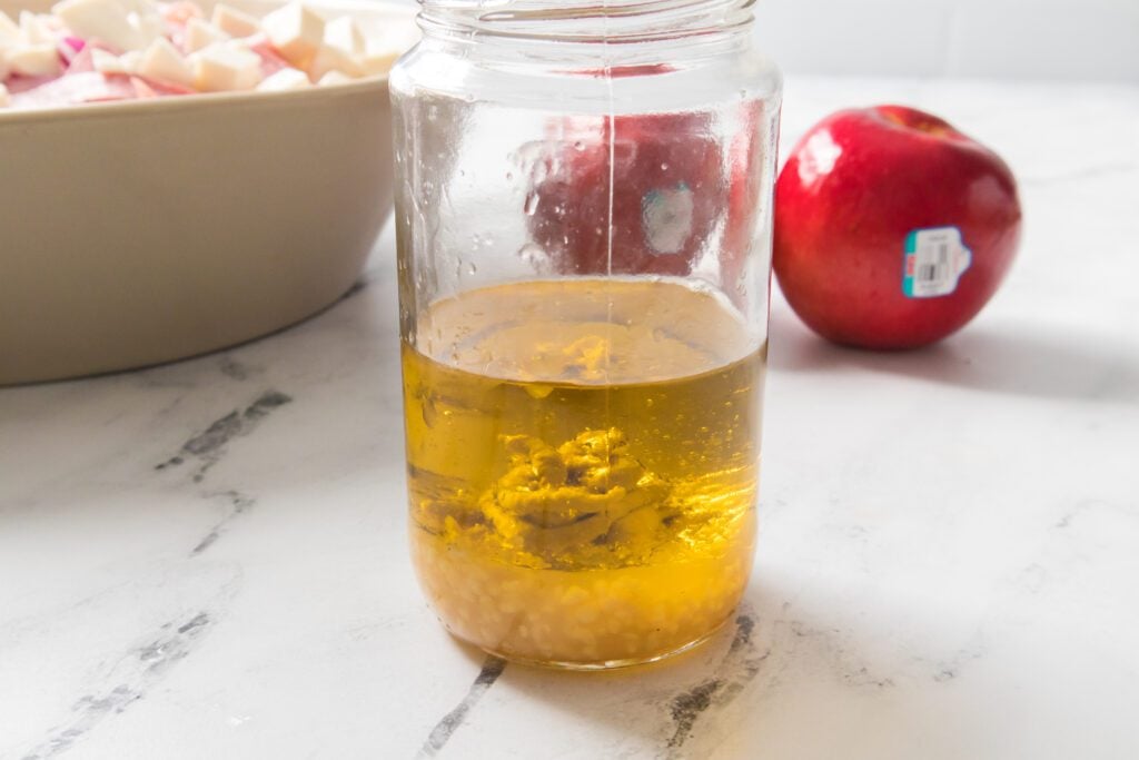 Mixing of lemon vinaigrette in a mason jar