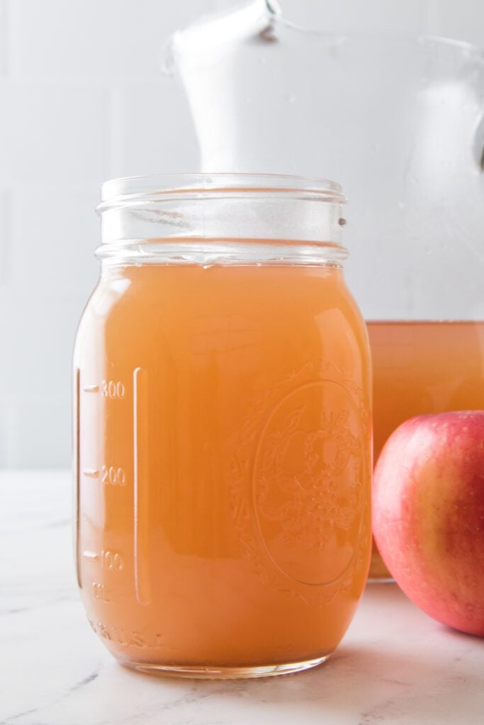 vertical shot of apple cider in mason jar