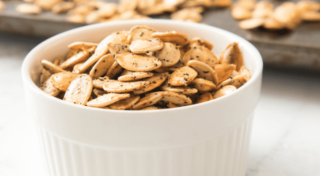 Roasted Pumpkin Seeds in white bowl
