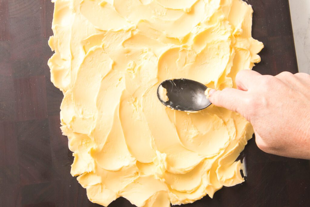 spreading butter on cutting board