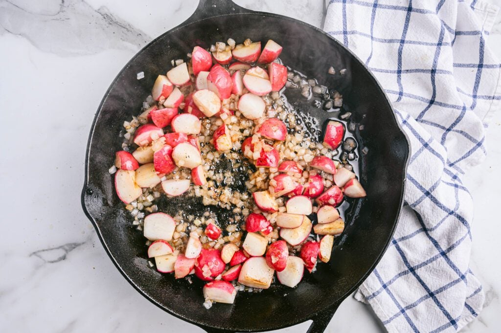 Stir and continue to cook until onions and radishes are crispy on all sides, about 8-10 minutes.