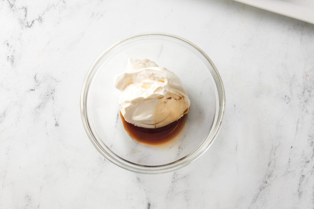 yogurt and vanilla extract in a glass bowl