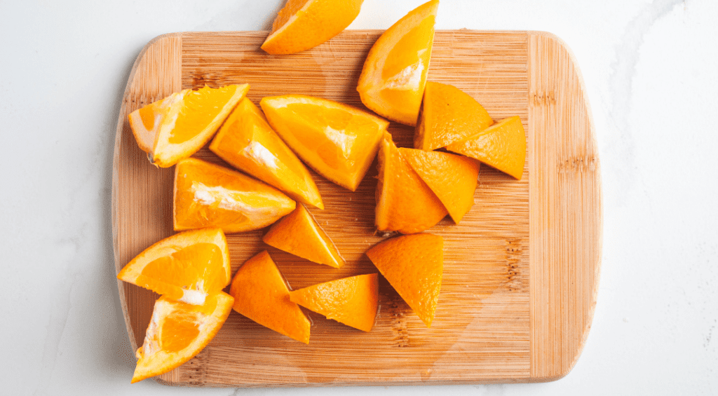 Points or oranges on cutting board