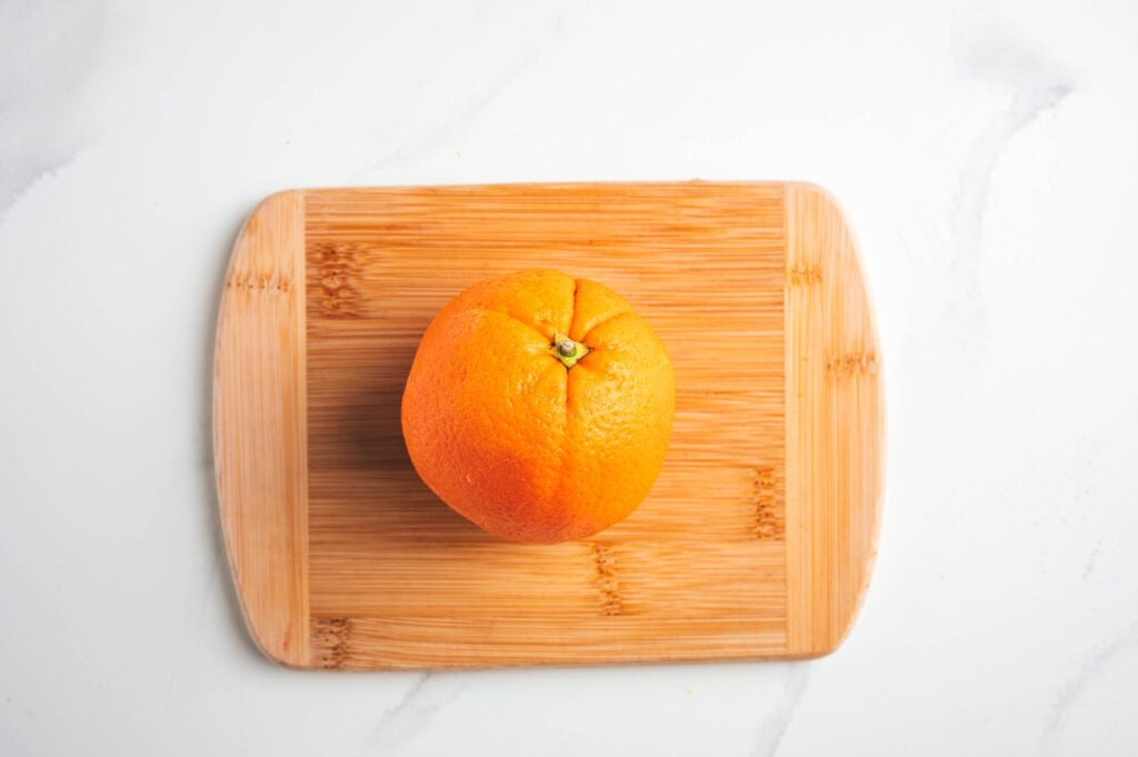 Orange on cutting board