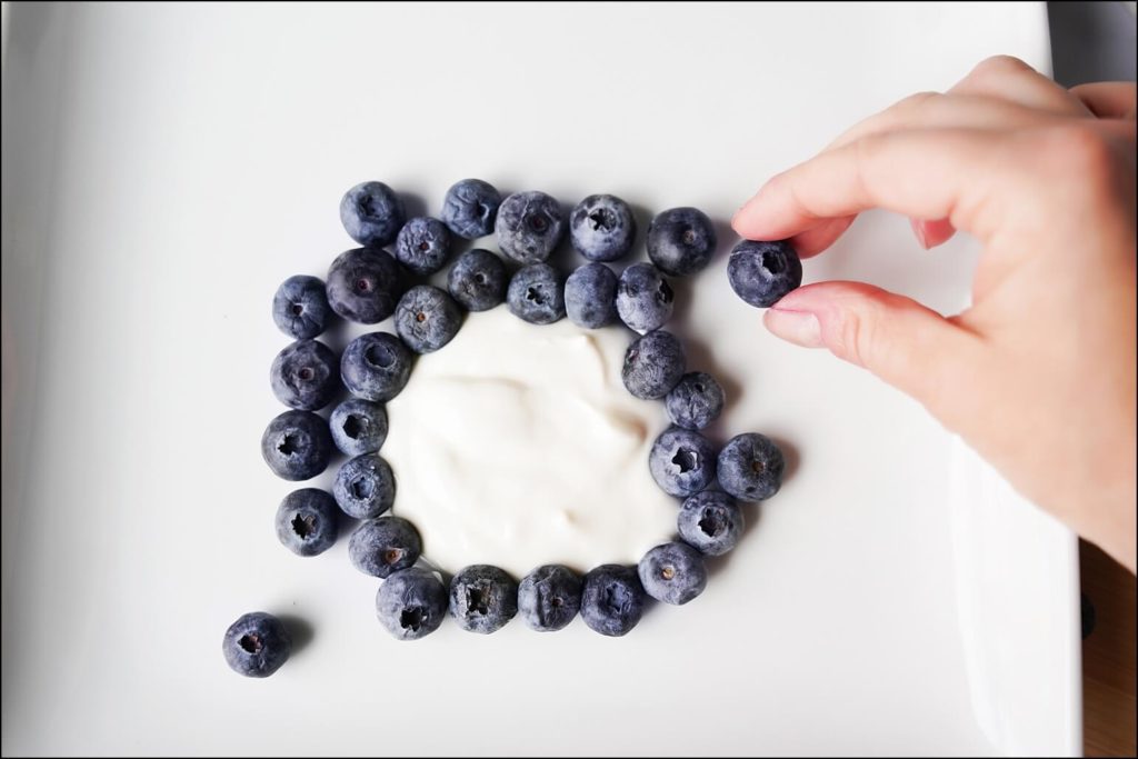 Building the blueberries around the yogurt belly