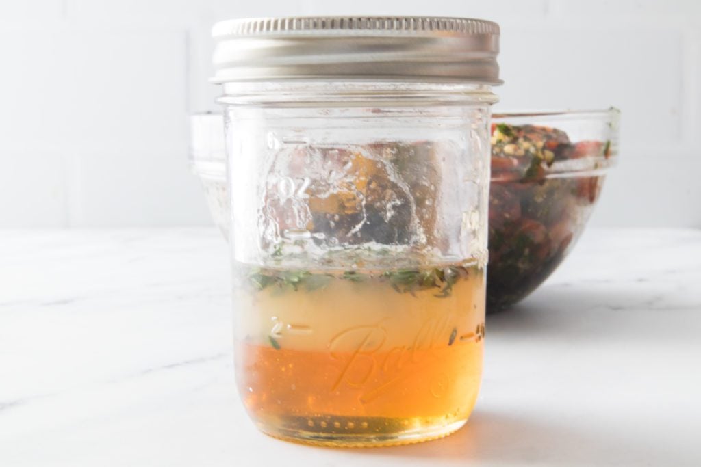 honey, lemon juice and thyme in mason jar