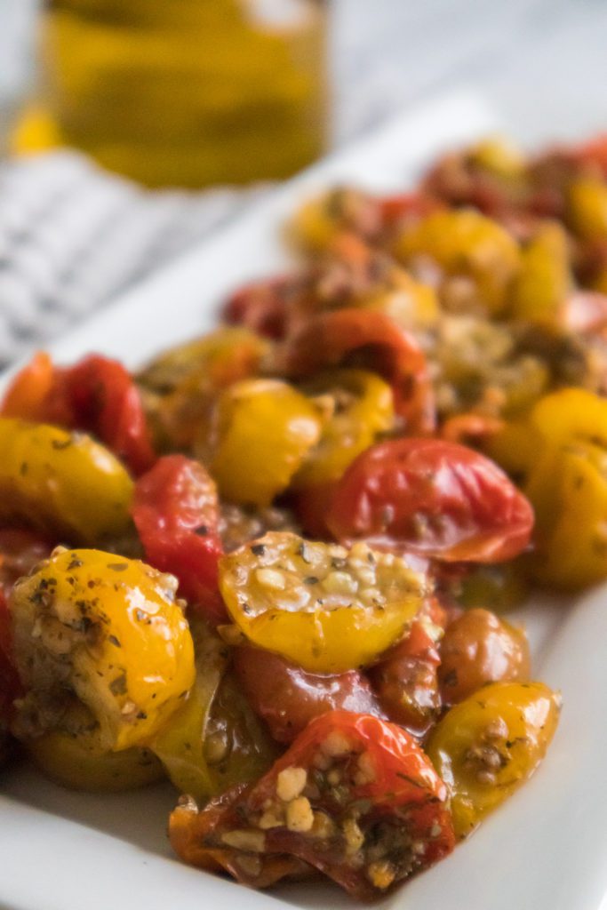 roasted cherry tomatoes on a serving platter