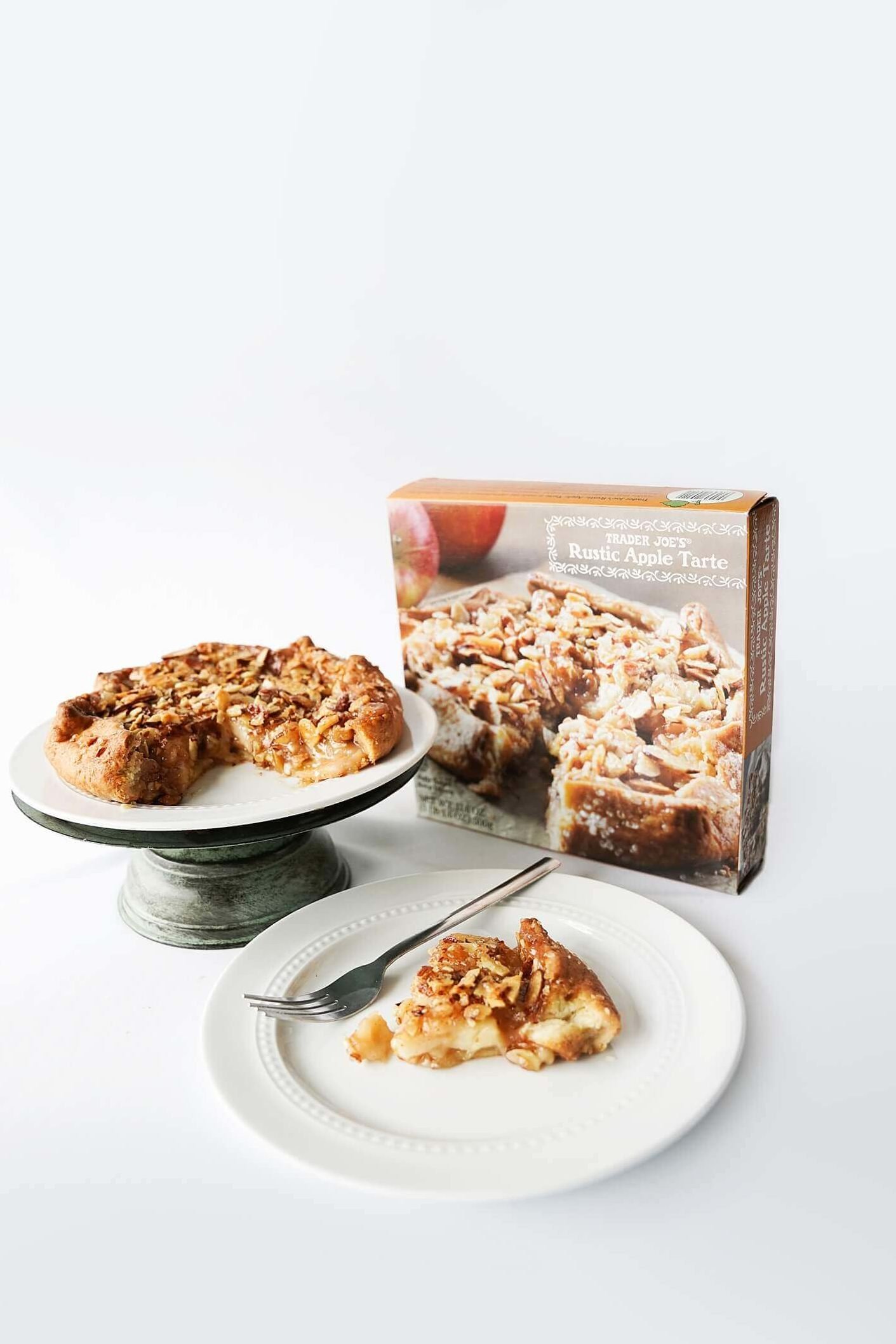 Trader Joe's Rustic Apple Tart in box, on pie plate and slice on plate