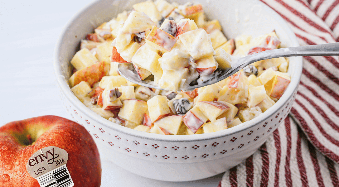 Mexican Apple Salad in bowl with Envy apple