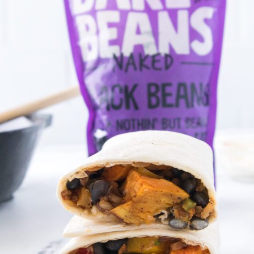 Focus shot on two Sweet Potato and Black Bean Burritos stacked on top of each other