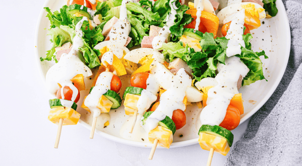 Skewers of chef salad on a stick on a plate