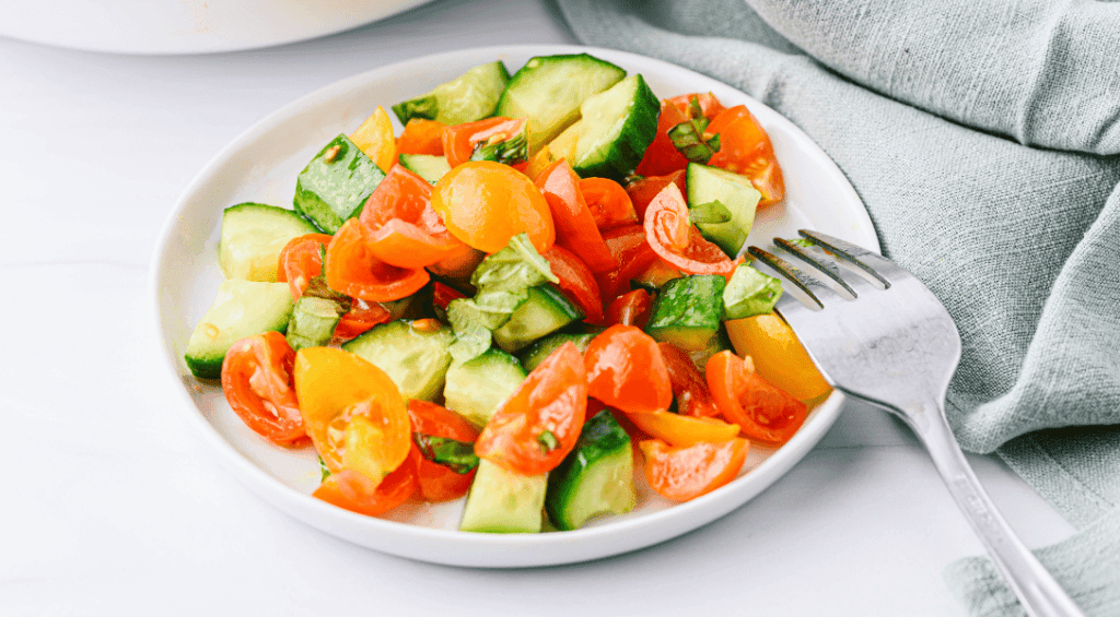 Cucumber and Tomato Salad on white plate