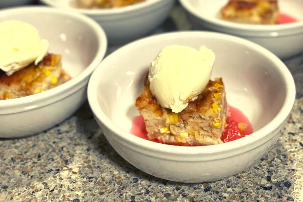 Sweet Corn Bread Pudding with Radish Marmalade & Celery Ice Cream in bowls