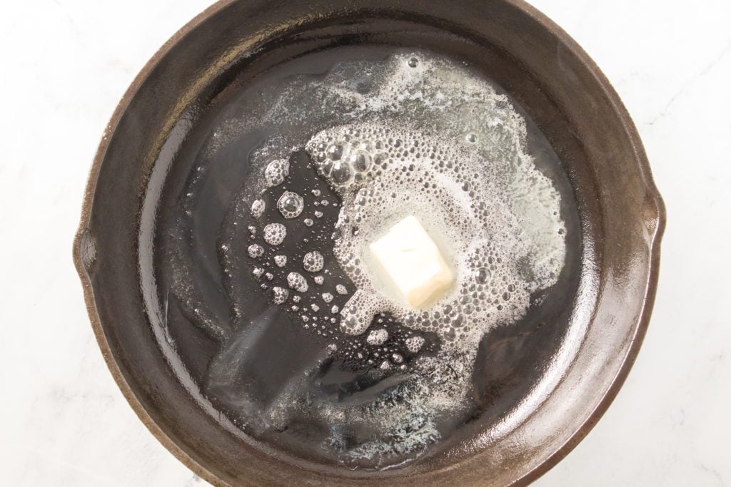 butter melting in cast iron skillet