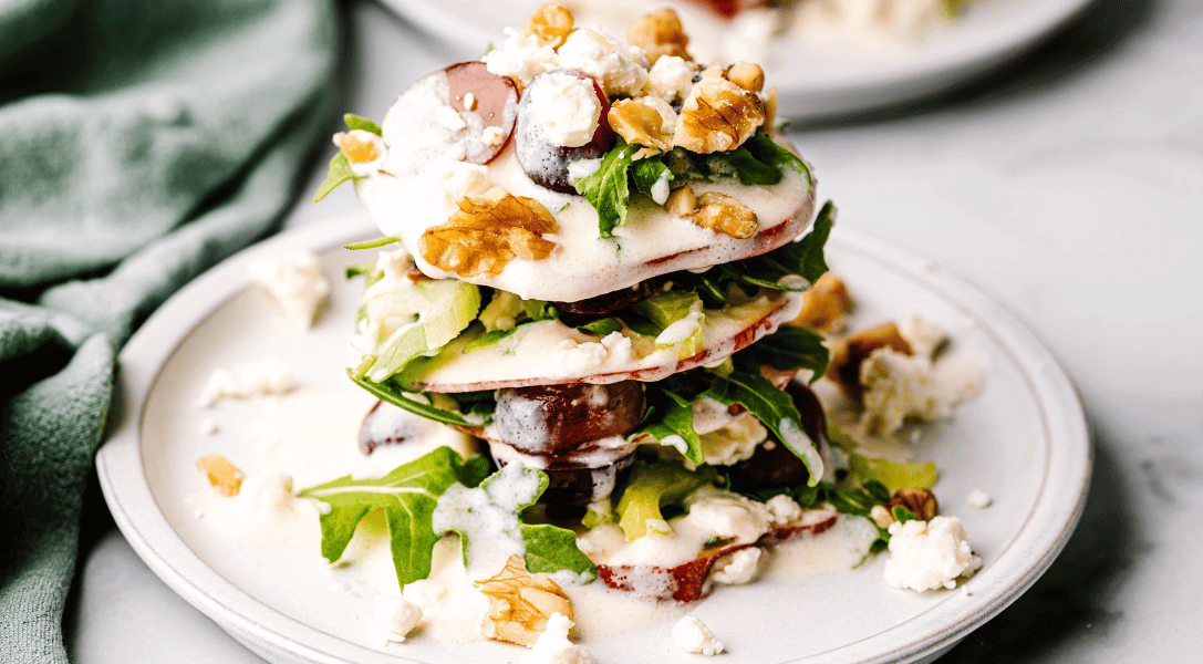 Stacked Apple Waldorf salad on White Plate