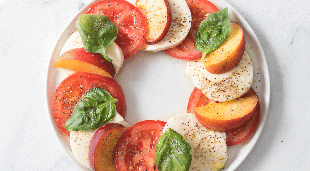 Ovearhead view of Peach Caprese on white plate