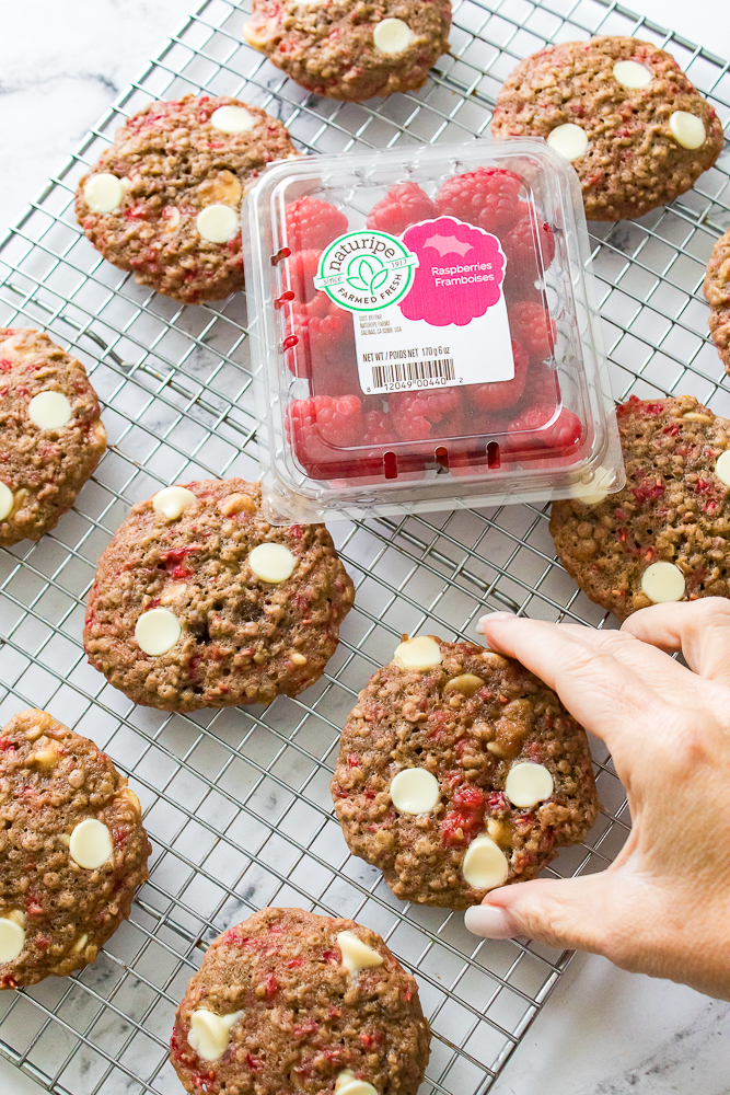 Oatmeal Raspberry bookies on wire rack with Naturipe package